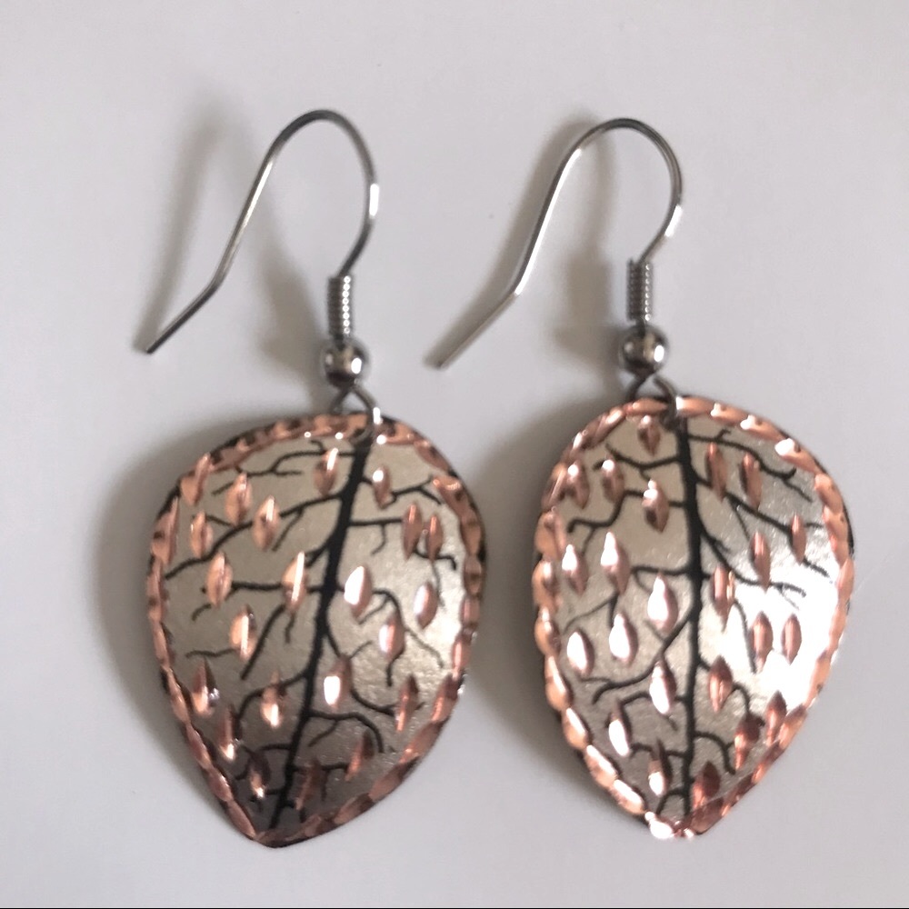 Handcrafted earrings. Silver, gold and copper colored leaves.